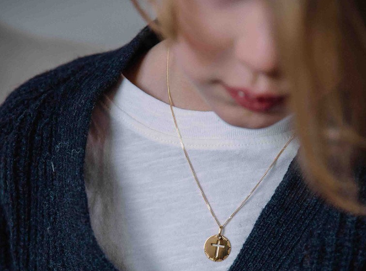 little girl with pendant around her neck