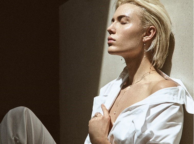 blonde woman with creoles and earrings