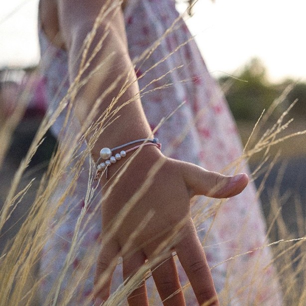 child with claverin bracelets